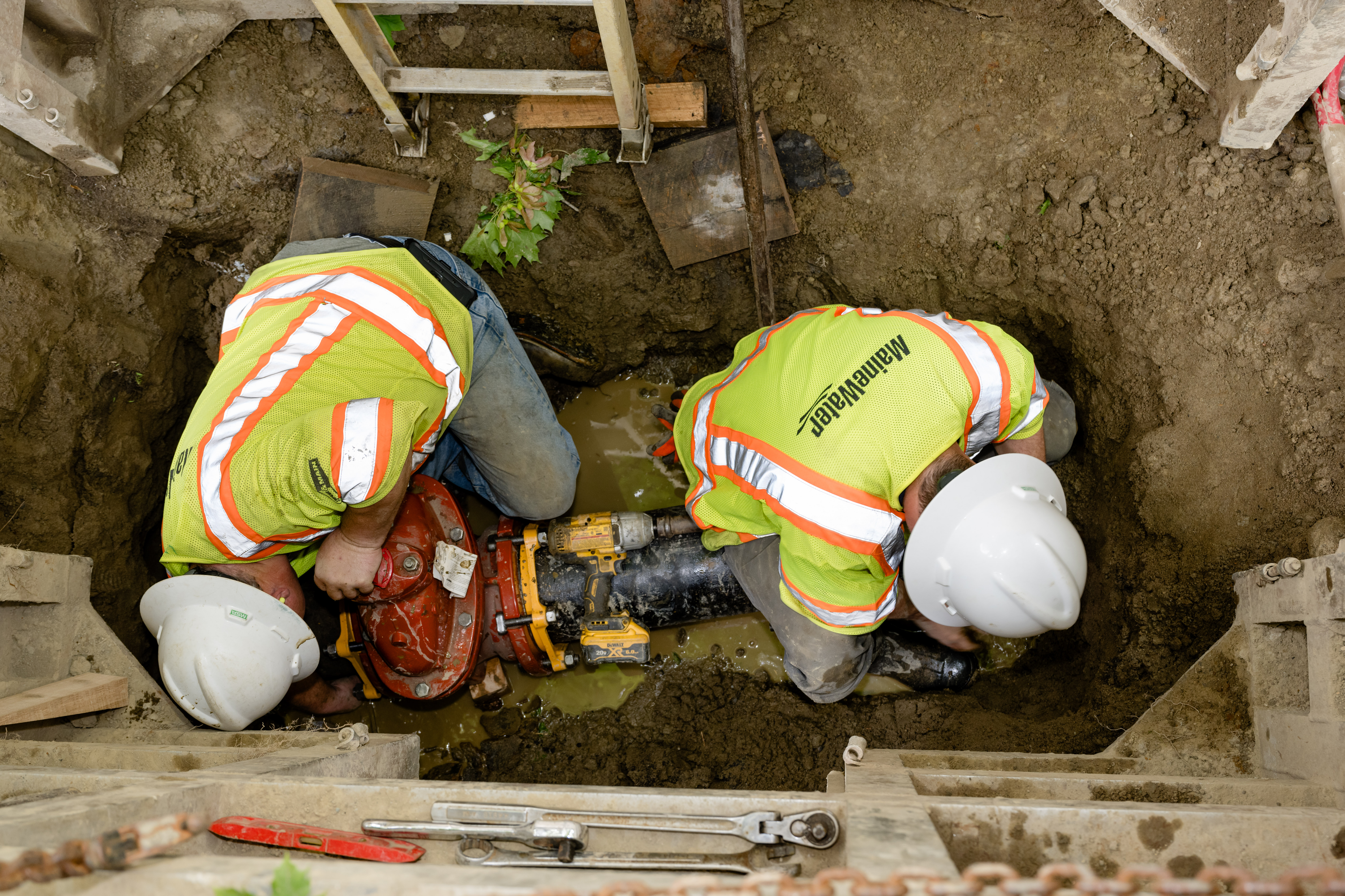 two people working on a water line