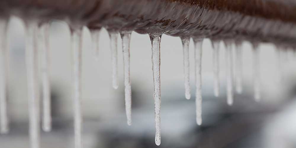 Photo of icicles on a water pipe